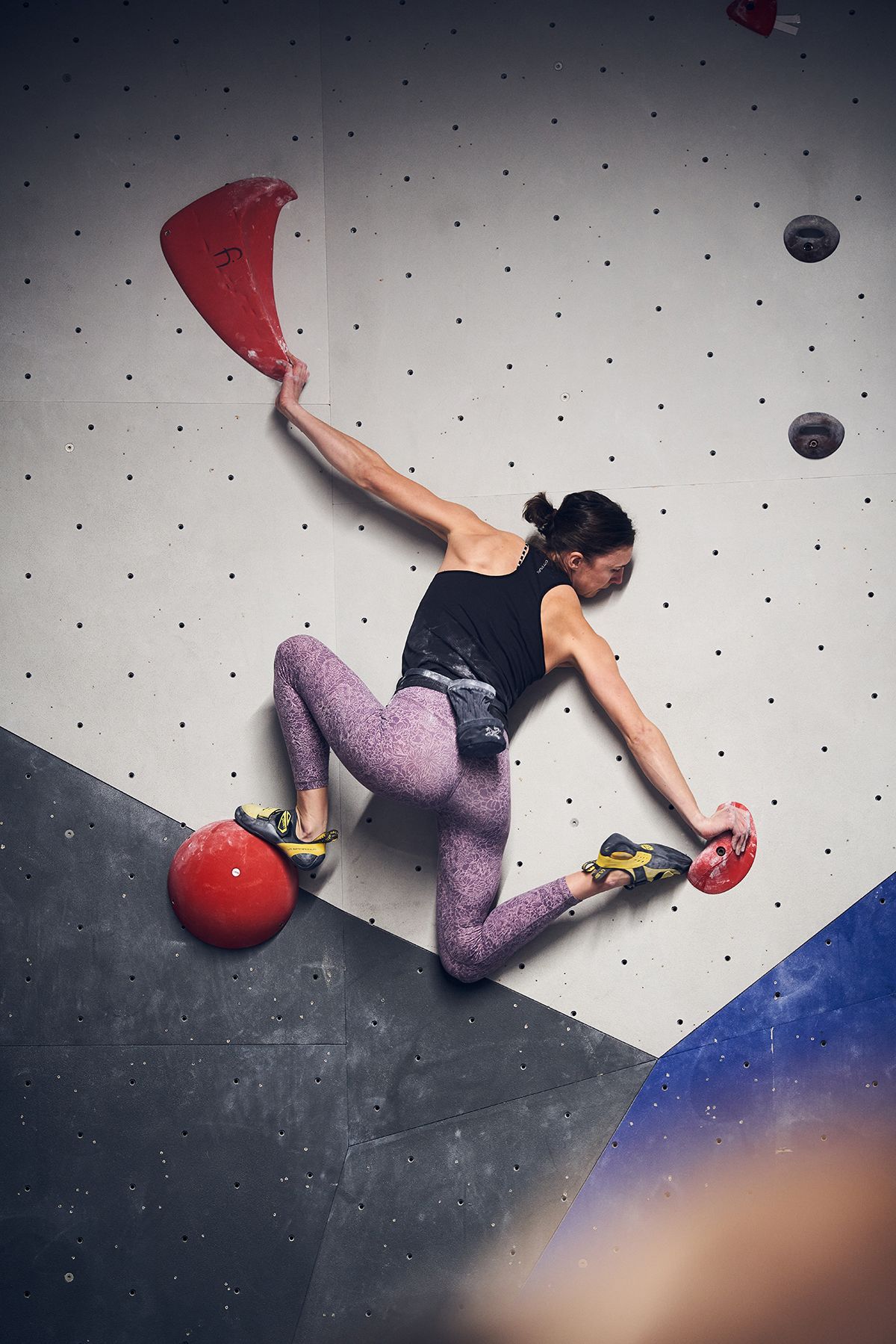 Female bouldering competitor