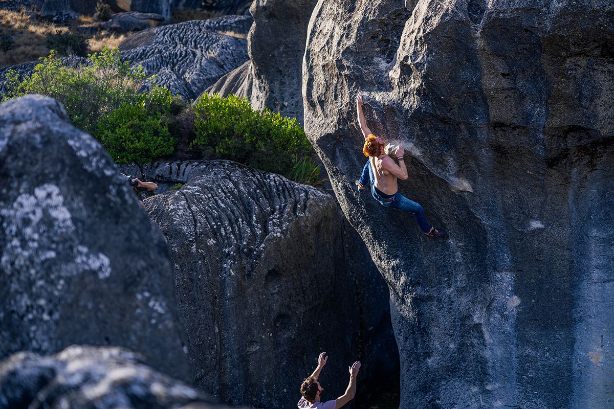 boulderer on limestone boulder