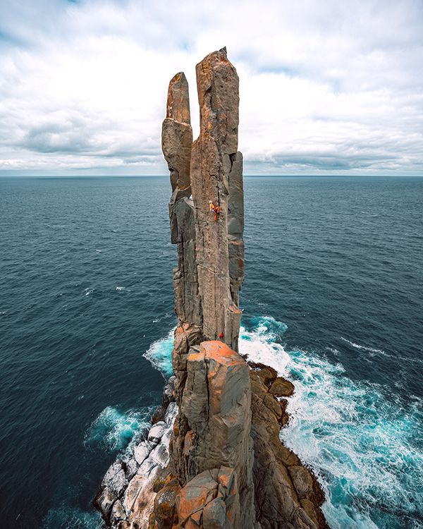 Climber on sea stack