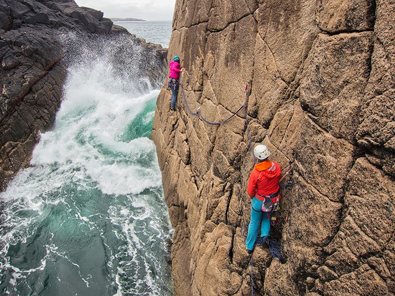 Climbers near waves