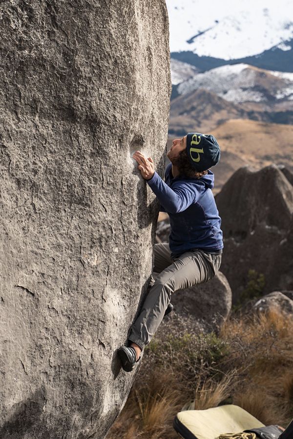 female climber on boulder problem