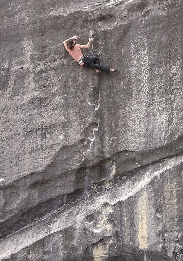 boulderer on limestone boulder