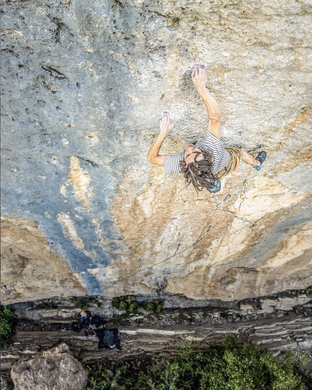 Male rock climber on blue limnestone rock