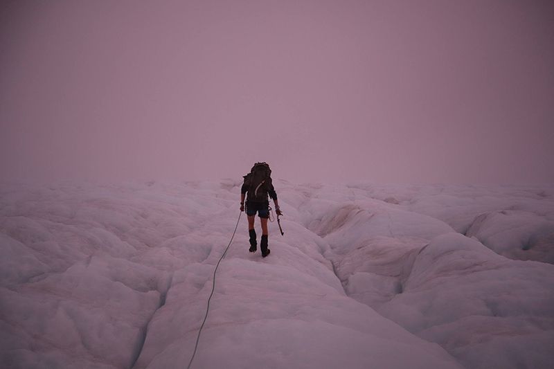 Climber in mist on glacier