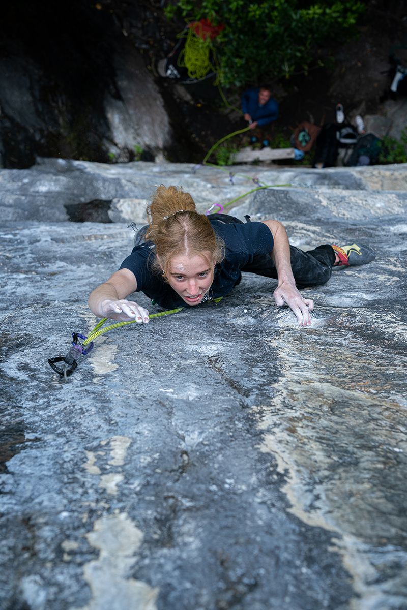 Female climber on face climb