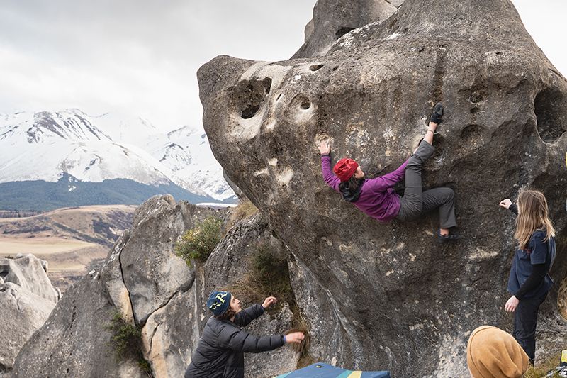 female climber on boulder problem