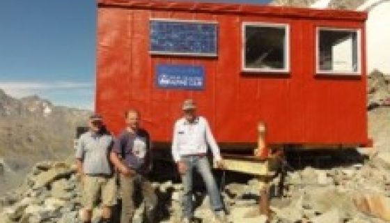 Murchison Hut exterior with people