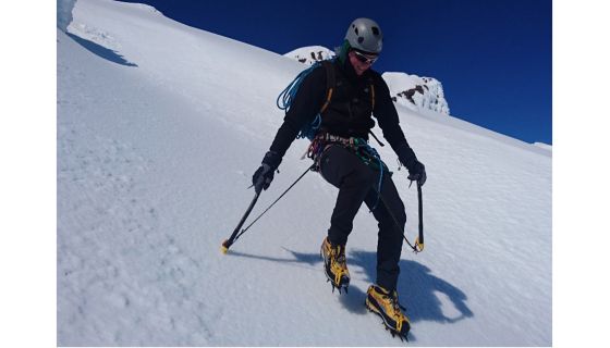 Mountaineer descending steep slope