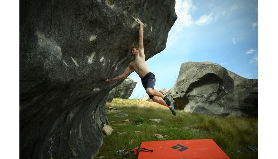 Boulderer jumping