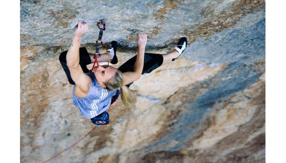 Femalew rock climber on terrifically hard route