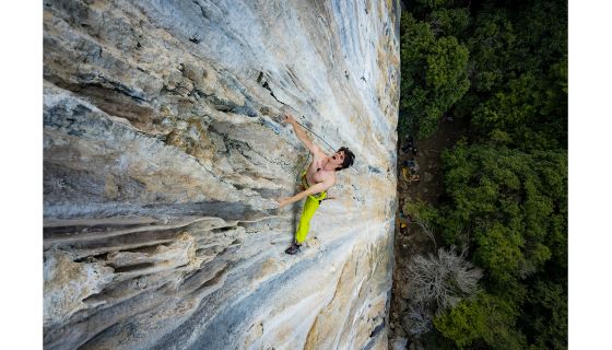 Rock climber clips carabiner